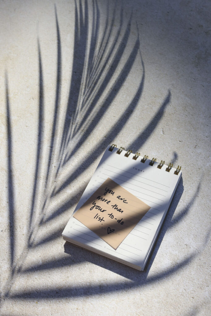 An image of a notepad with a note that says - you are more than your to-do list. How to get clear on what you want and why.